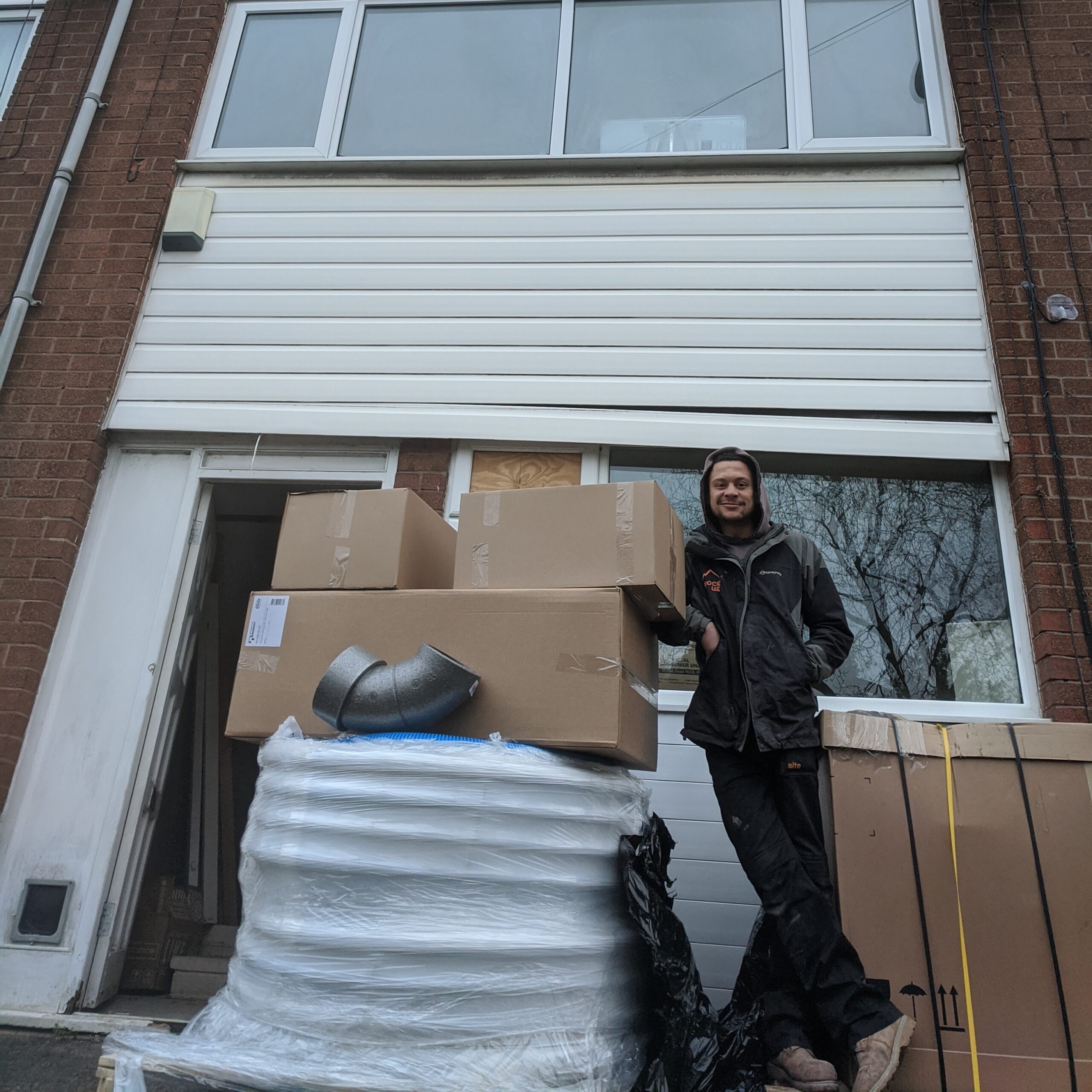 Russell Selby passive house consultant standing infront of passive house